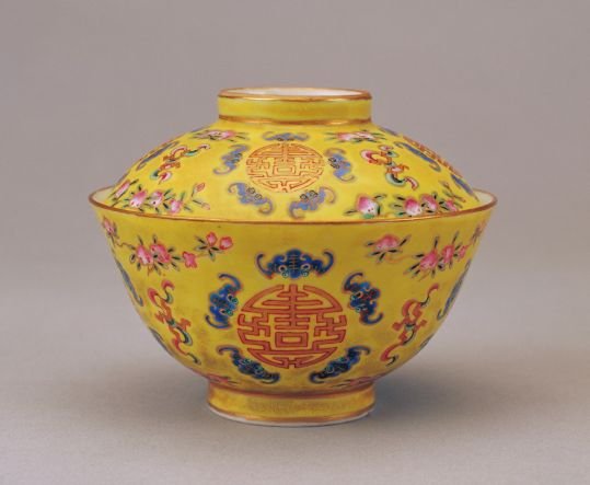 Yellow ground pastel five bats holding bowl with longevity character, The Palace Museum