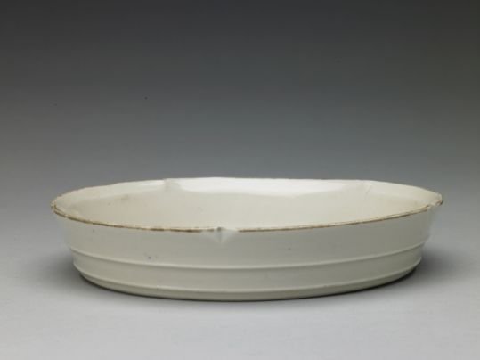 Ding kiln white glaze carved hibiscus pattern cane segment flower mouth wash, The Palace Museum