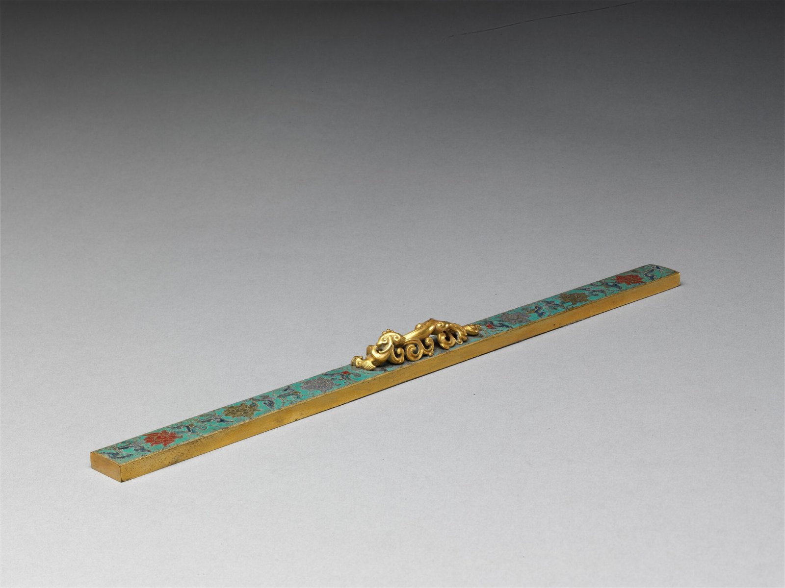 Cloisonné enamel chi-button ruler with lotus pattern, The Palace Museum